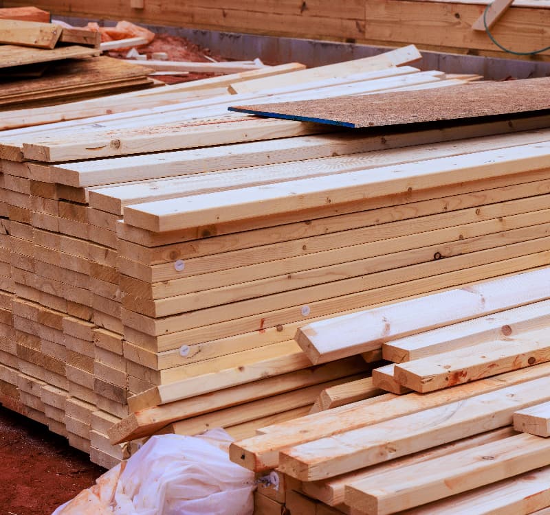 timber planks piled in warehouse
