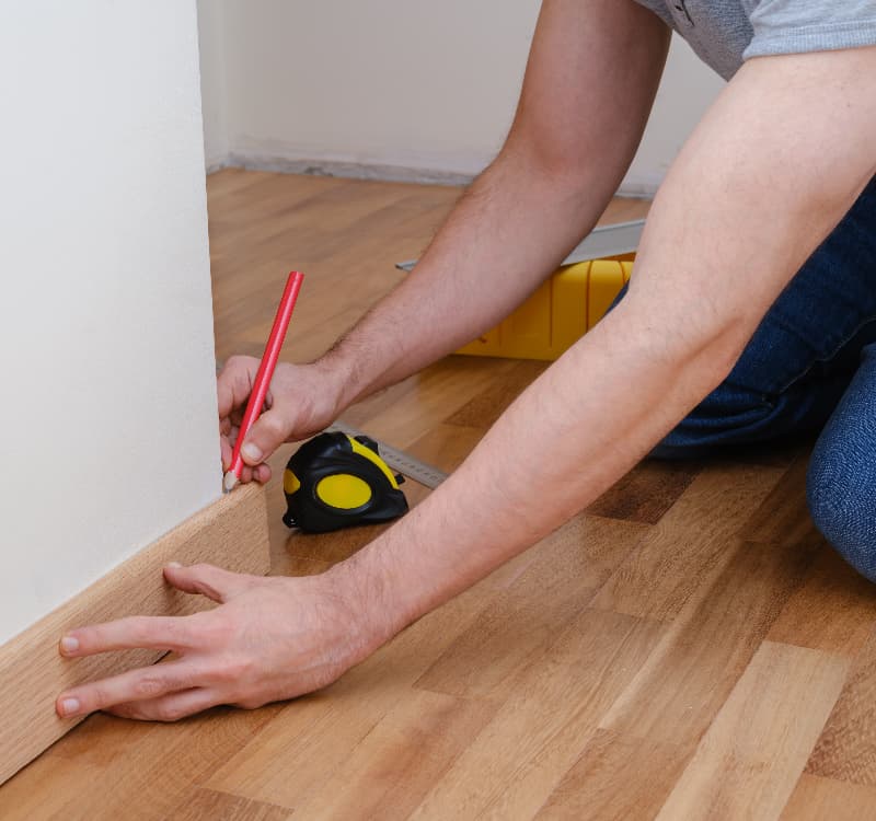 Man with skirting board