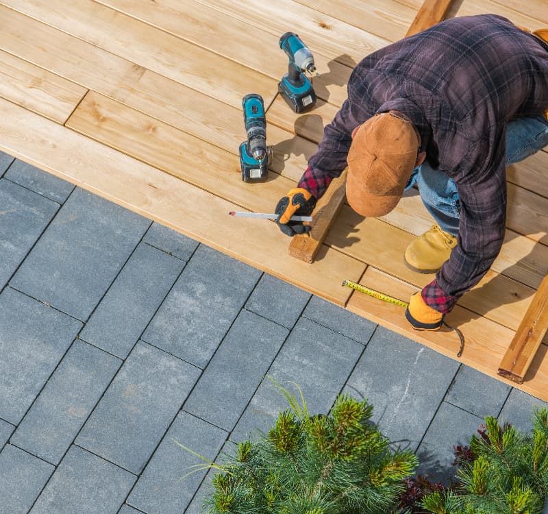 man working on timber decking