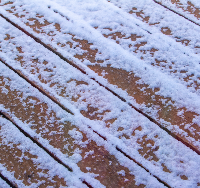timber decking under snow
